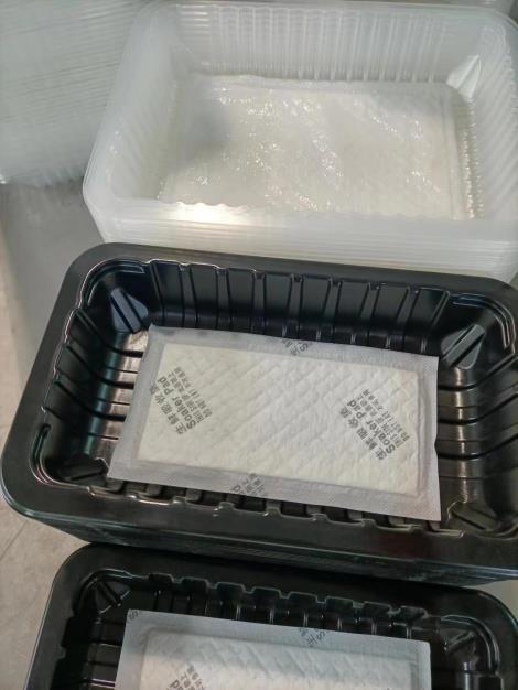 生鲜托盘整理放置吸水垫全自动落盒机